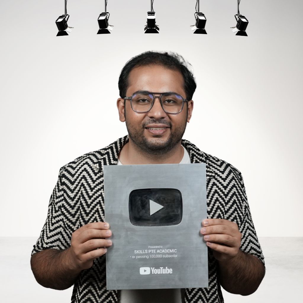 Instructor holding YouTube Silver Play Button